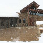 Nice Home in Snow Storm with snowmelt system installed in the driveway.