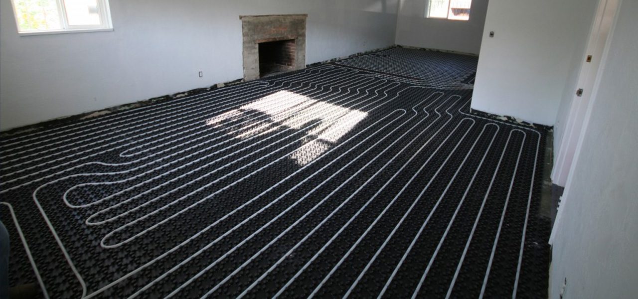 A large room in a home with floor heating system being installed.